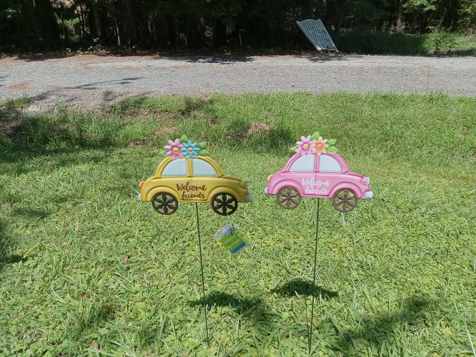 v. w. set of 2 one pink and one yellow garden stakes